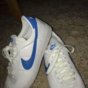 Vintage leather white nikes with blue swoosh